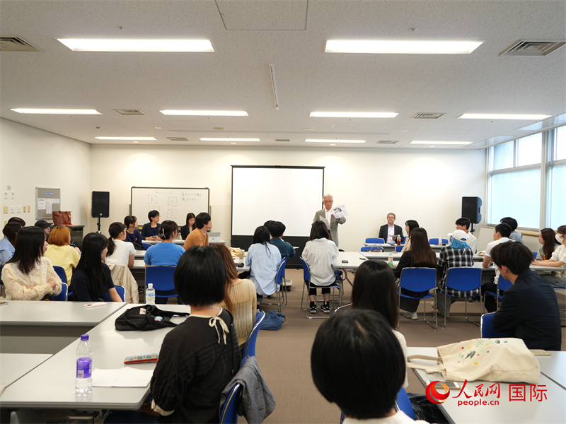 活動報告會現場。人民網 許可攝